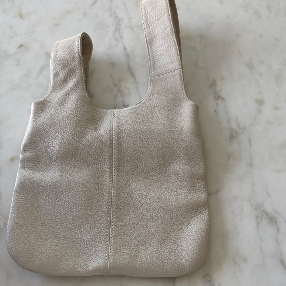 Bone pebble grain genuine leather small hand bag  10” x 17”. Lined. No wear.